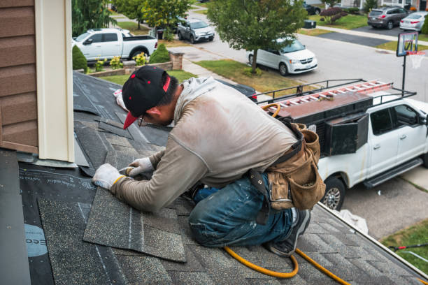 Professional Roofing technician working in London, CA